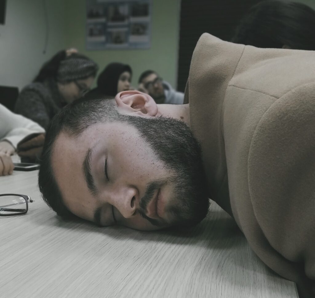 Man sleeping with head on table